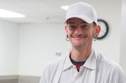 FareStart student smiling in the kitchen