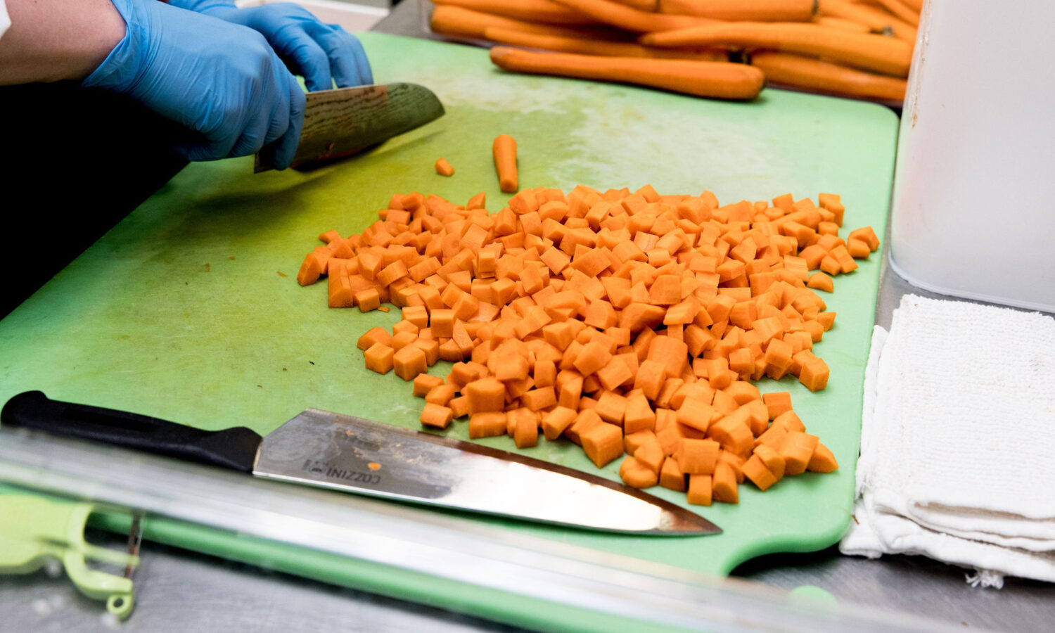 Carrots being diced in a FareStart kitchen