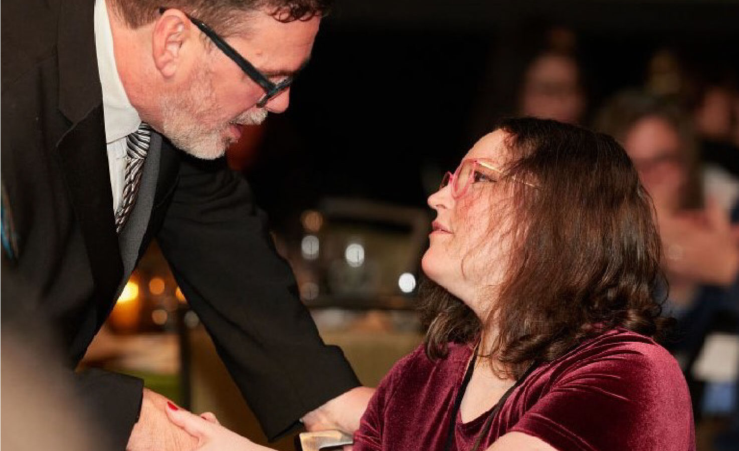 FareStart graduate Chelsea shaking hands with FareStart CEO, Patrick D'Amelio