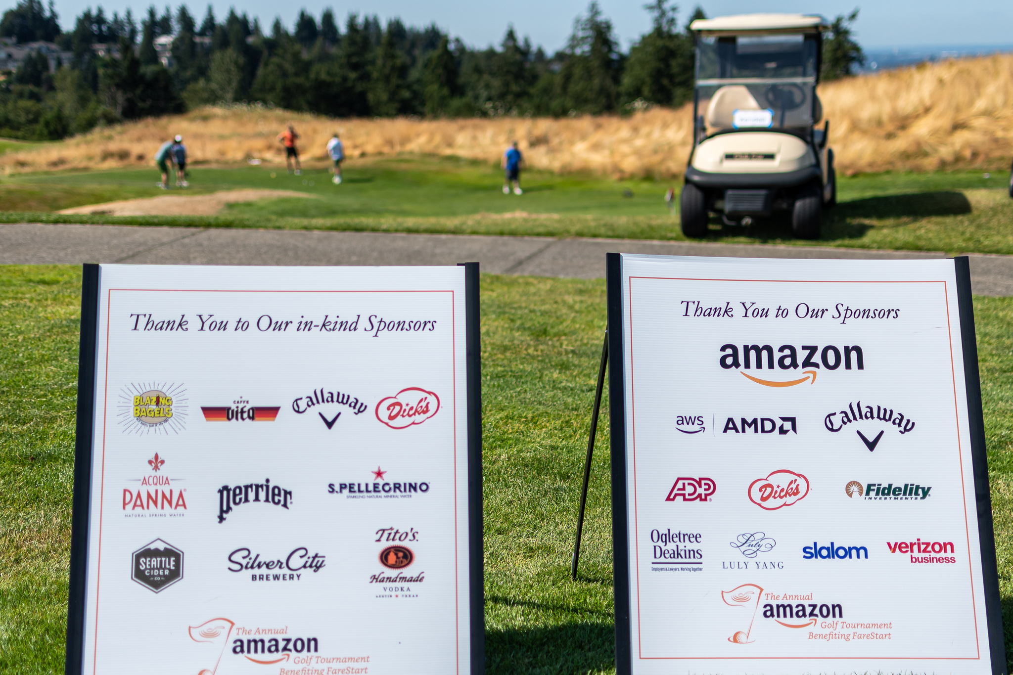 Sponsor logo signs at the Amazon Golf Tournament