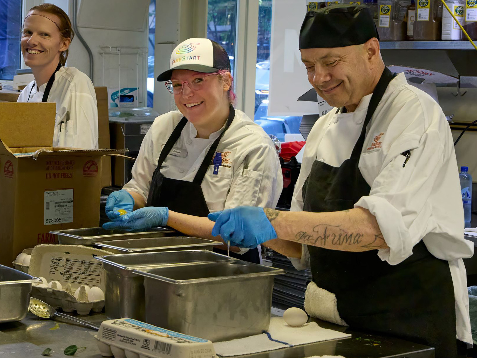 Food Pathways Program Graduates working at Guest Chef Night
