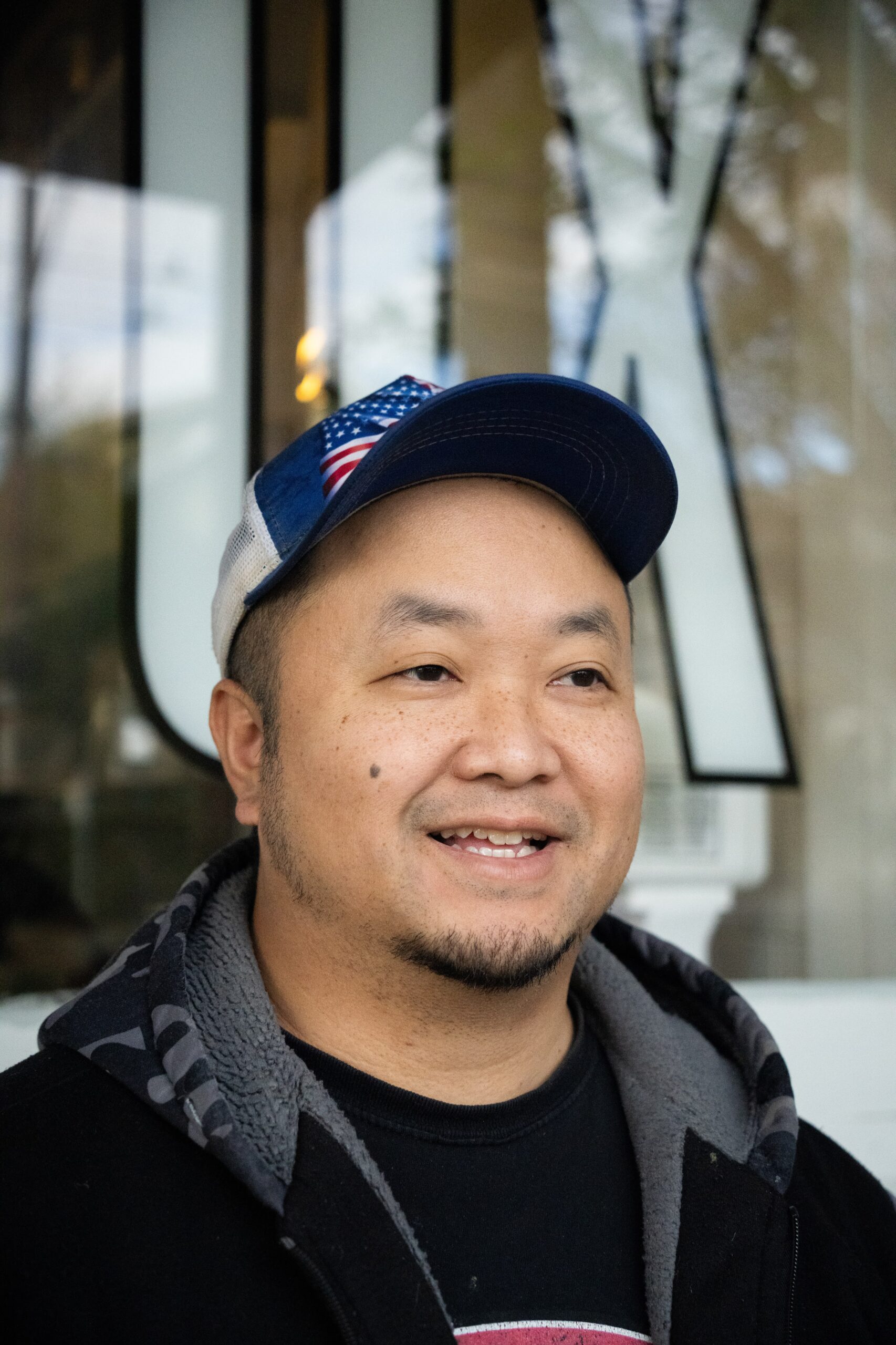 Chef Khampaeng smiling and looking to the right of the camera