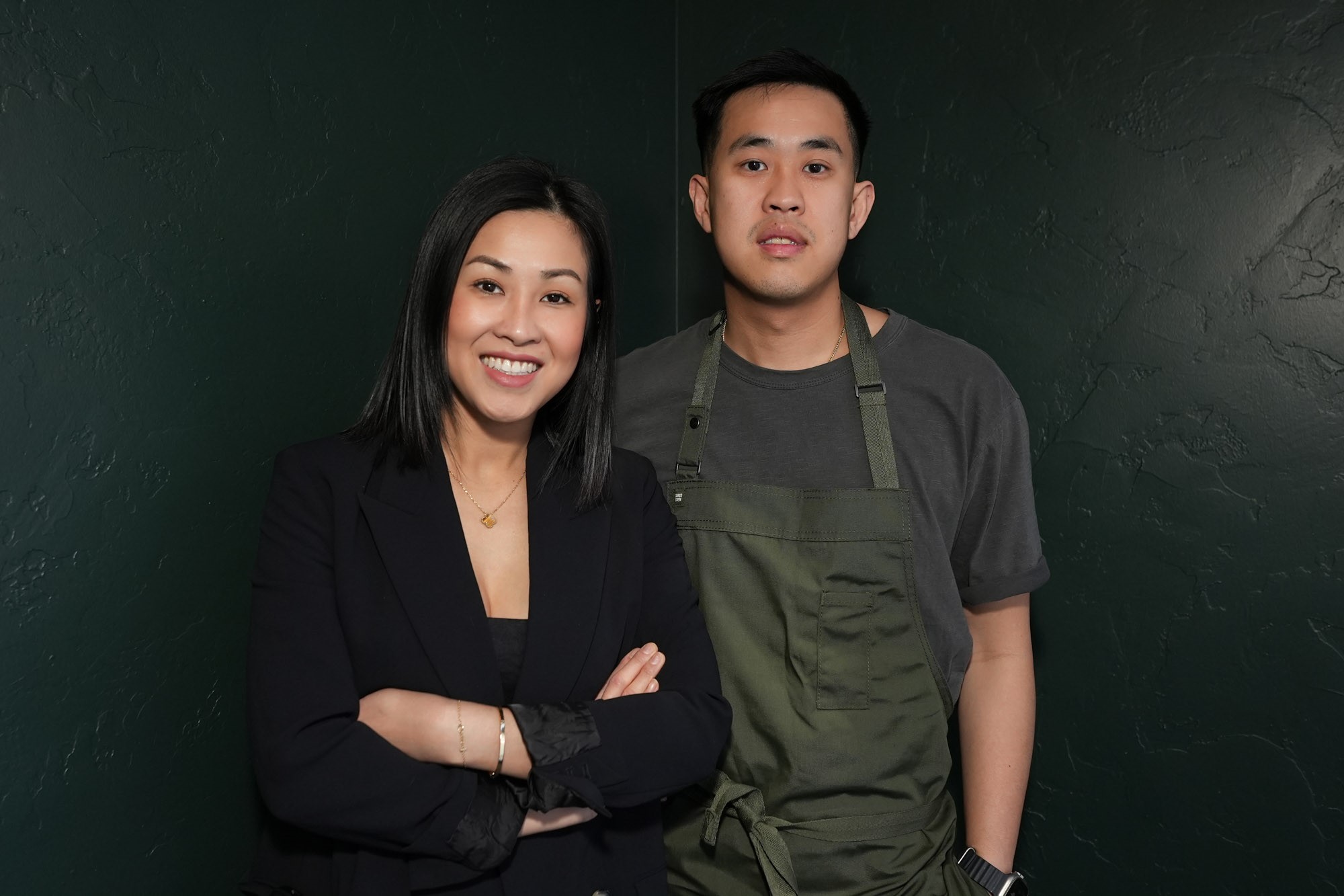 A photo of Trinh and Thai Nguyen on a dark background