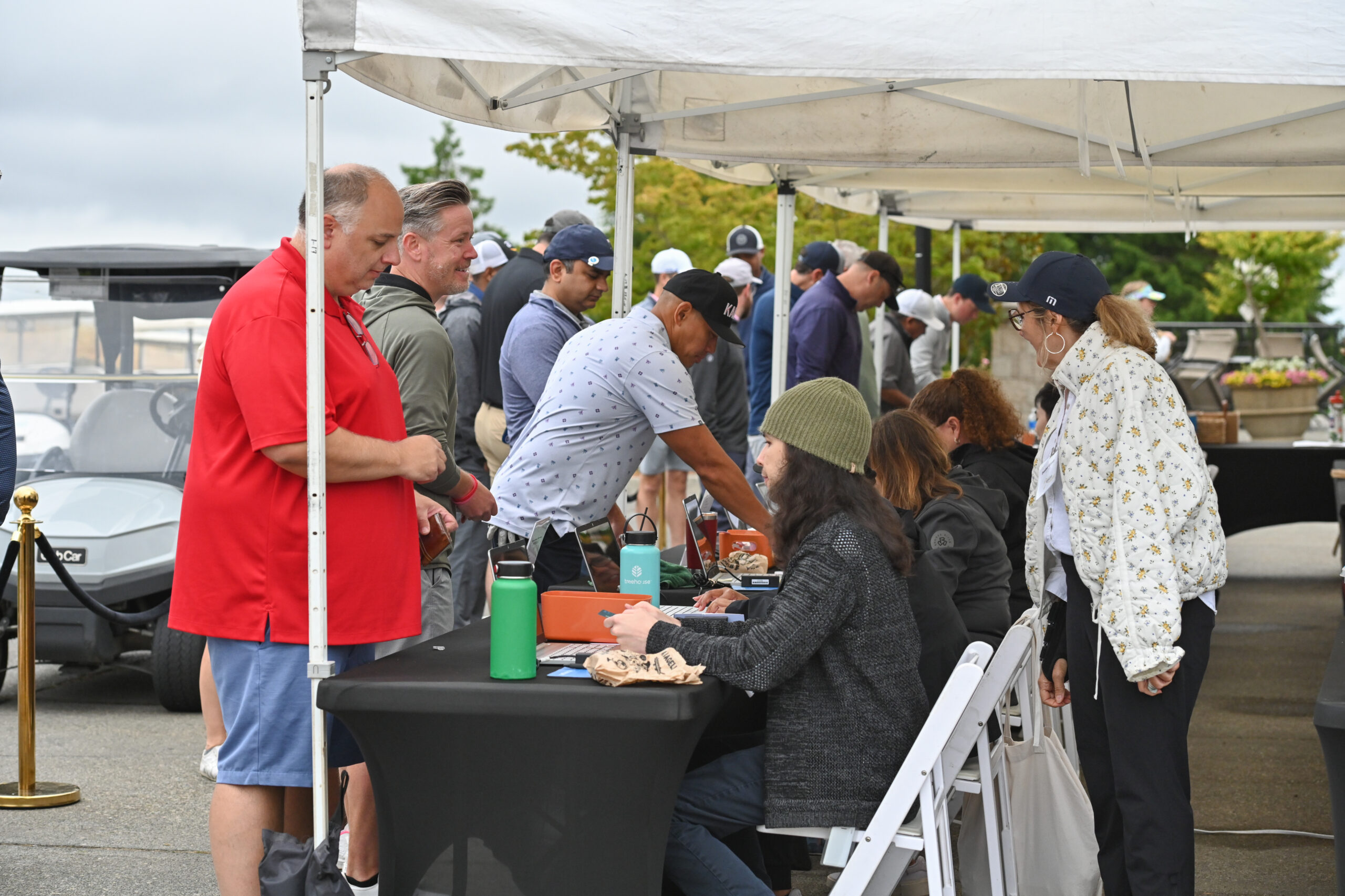 Attendee and check in line at the Amazon Annual Golf Tournament benefiting FareStart
