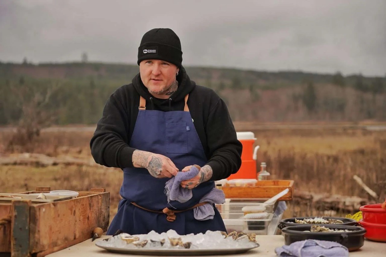 Chef Brendan McGill shucking oysters