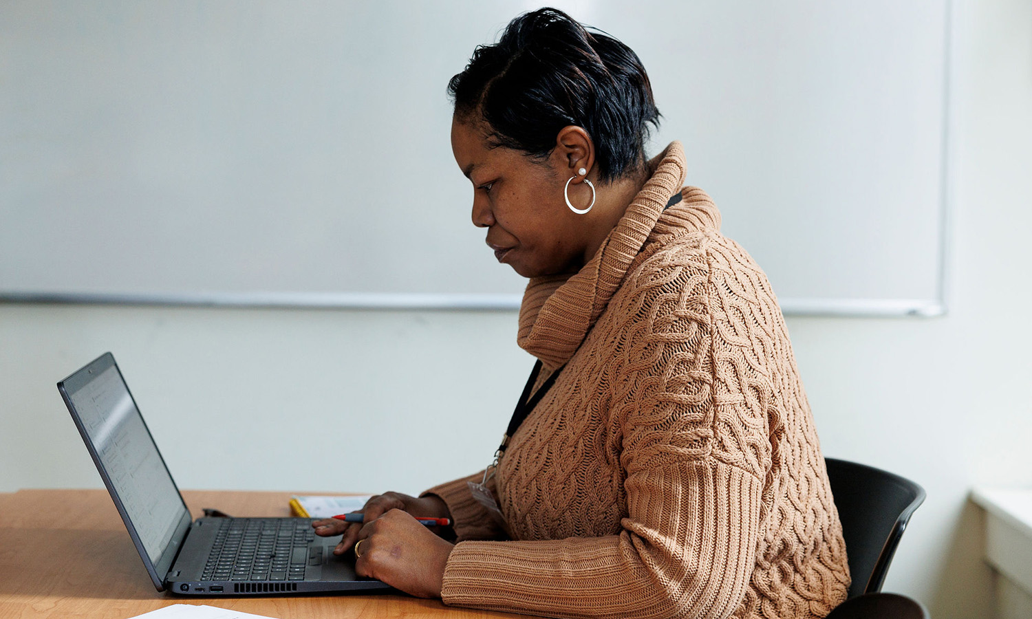 Chermell, FareStart's Barista & Customer Service Manager, providing online instruction